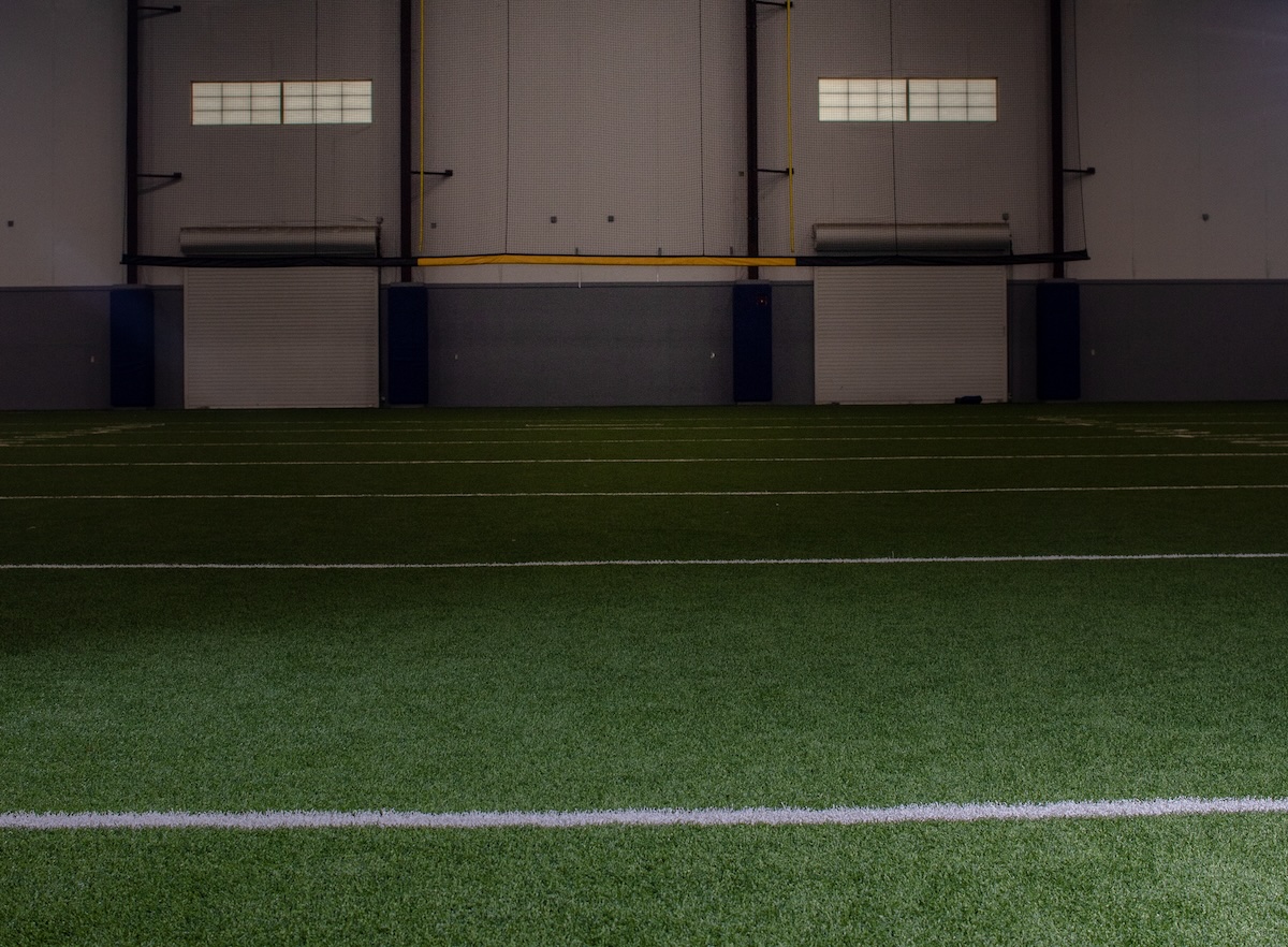 What Goes Under Artificial Turf in Sports Facility Construction?